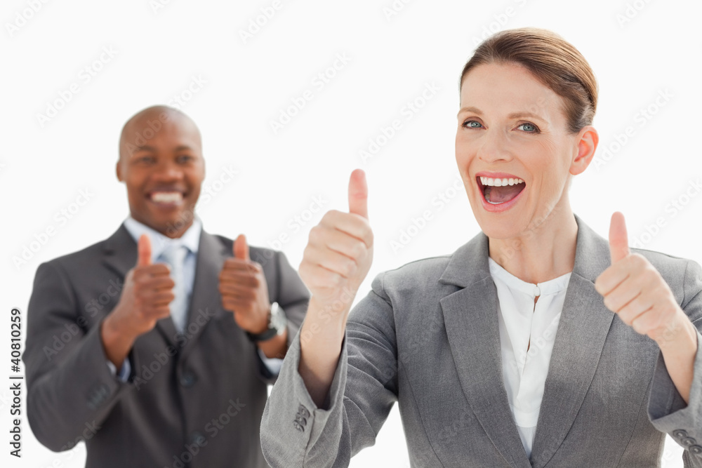 Excited businesspeople with thumbs up Excited businesspeople with thumbs up