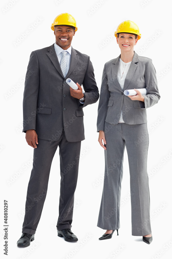 Businesspeople wearing hard hats Businesspeople wearing hard hats