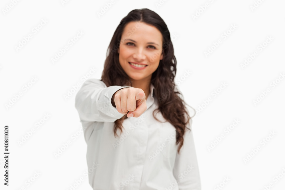 Portrait of a smiling brunette pointing Portrait of a smiling brunette pointing