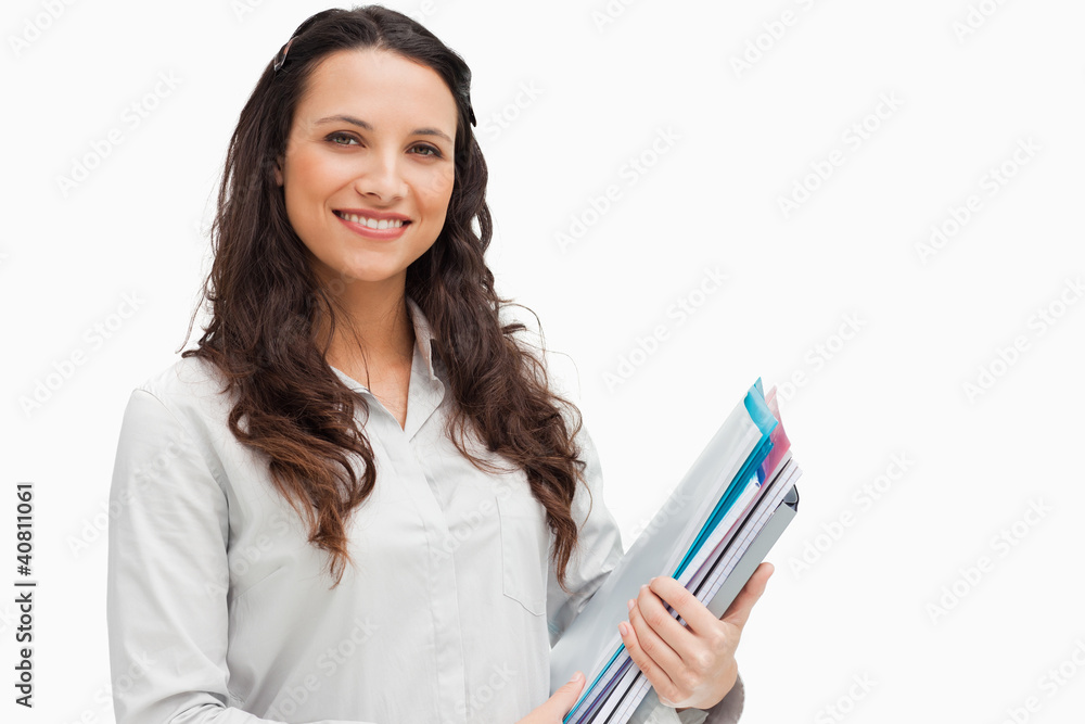 Portrait of brunette holding files Portrait of brunette holding files