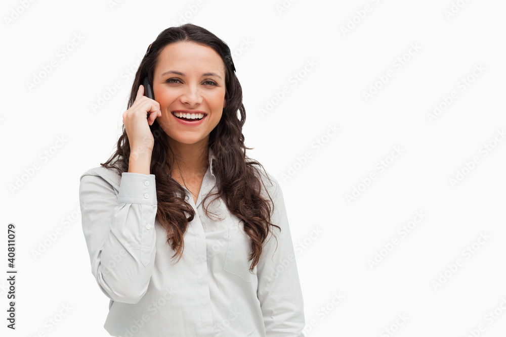 Close-up of a brunette grimacing while phoning Close-up of a brunette grimacing while phoning