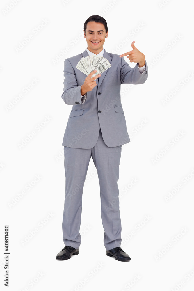 Portrait of a good-looking man showing a lot of dollars