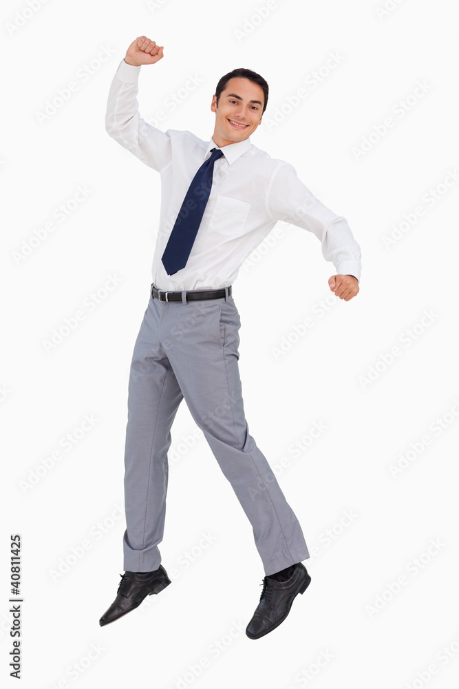 Businessman raising his arms and jumping Businessman raising his arms and jumping