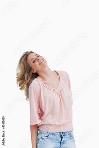Smiling blonde woman holds her head back © WavebreakmediaMicro