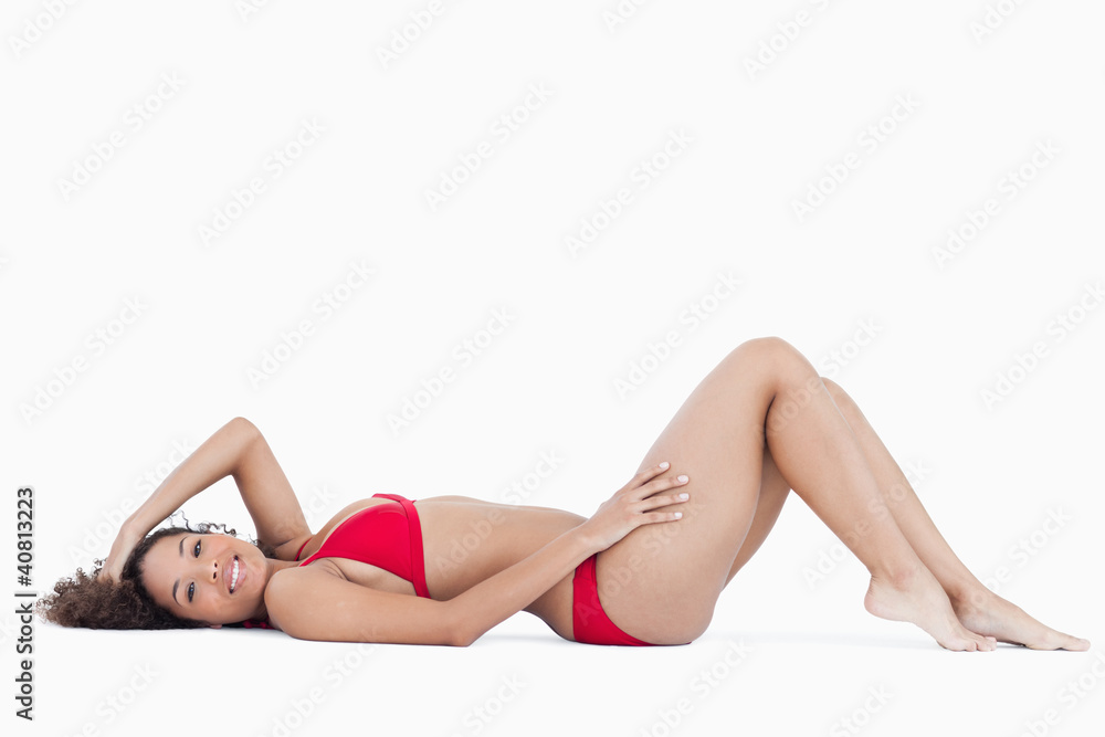 Smiling brunette woman lying down Smiling brunette woman lying down