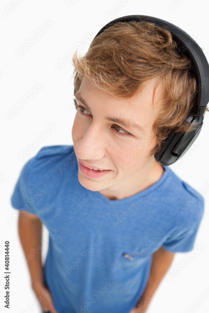 Fisheye view of a male student wearing headphones Fisheye view of a male student wearing headphones