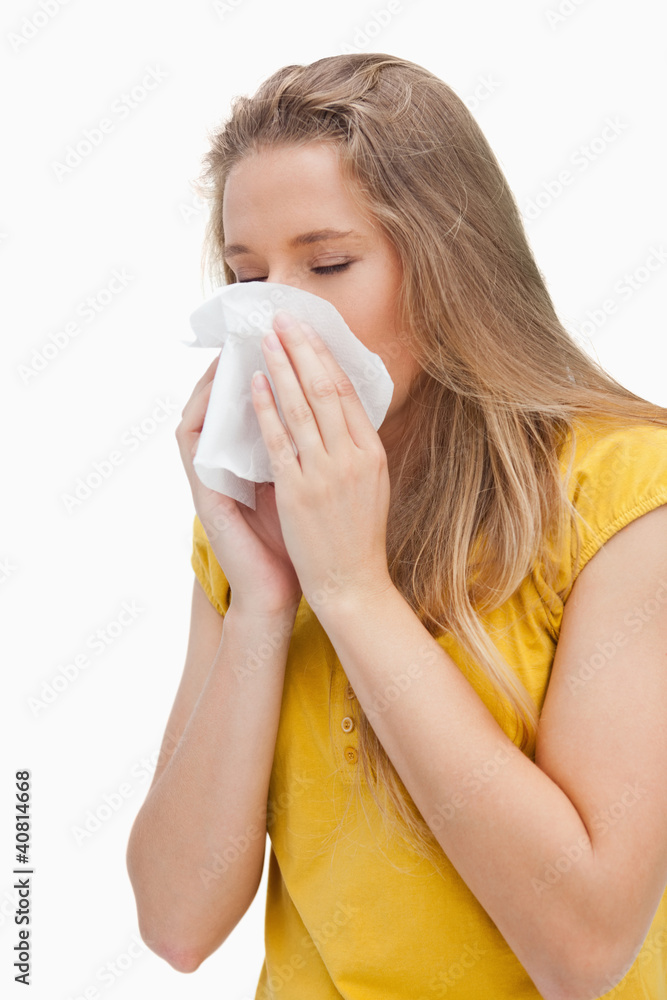 Close-up of a blond woman blowing Close-up of a blond woman blowing