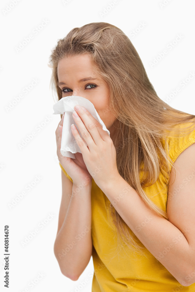 Portrait of a blond woman blowing Portrait of a blond woman blowing