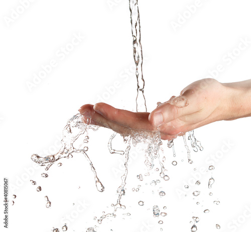 human hands with water splashing on them