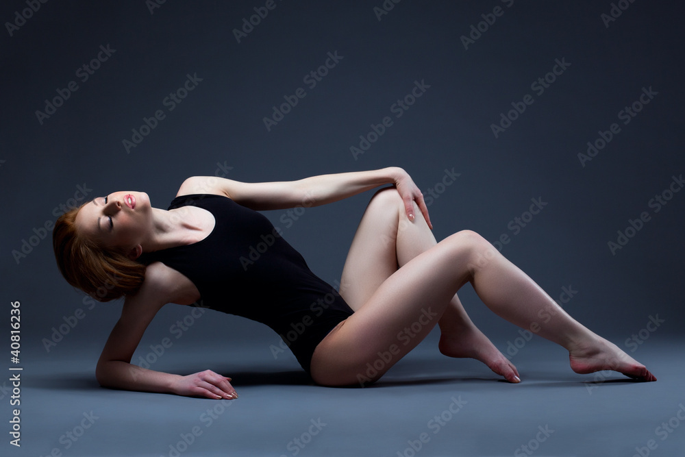 Beautiful sexy woman lay in sport suit