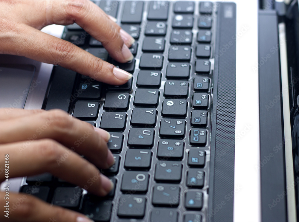 woman hand typing laptop's keyboard woman hand typing laptop's keyboard