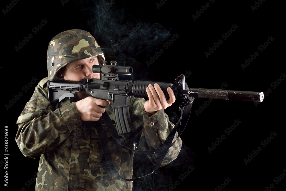 Alerted soldier keeping a smoking gun Alerted soldier keeping a smoking gun