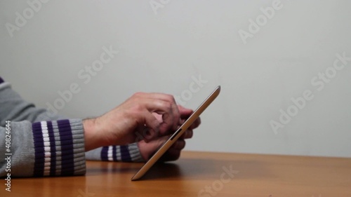 Hands of casual user on a tablet