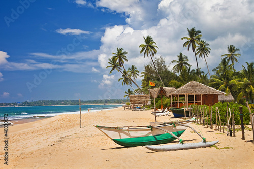 deserted tropical beach with boat, Sri lanka