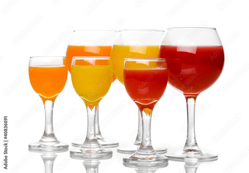 Tropical juices in glasses isolated on white Tropical juices in glasses isolated on white
