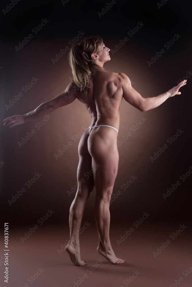 strong woman body builder walk side