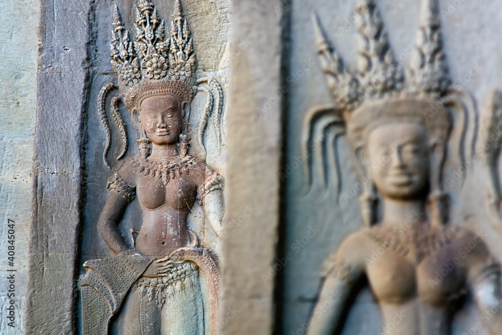 carved apsara dancers