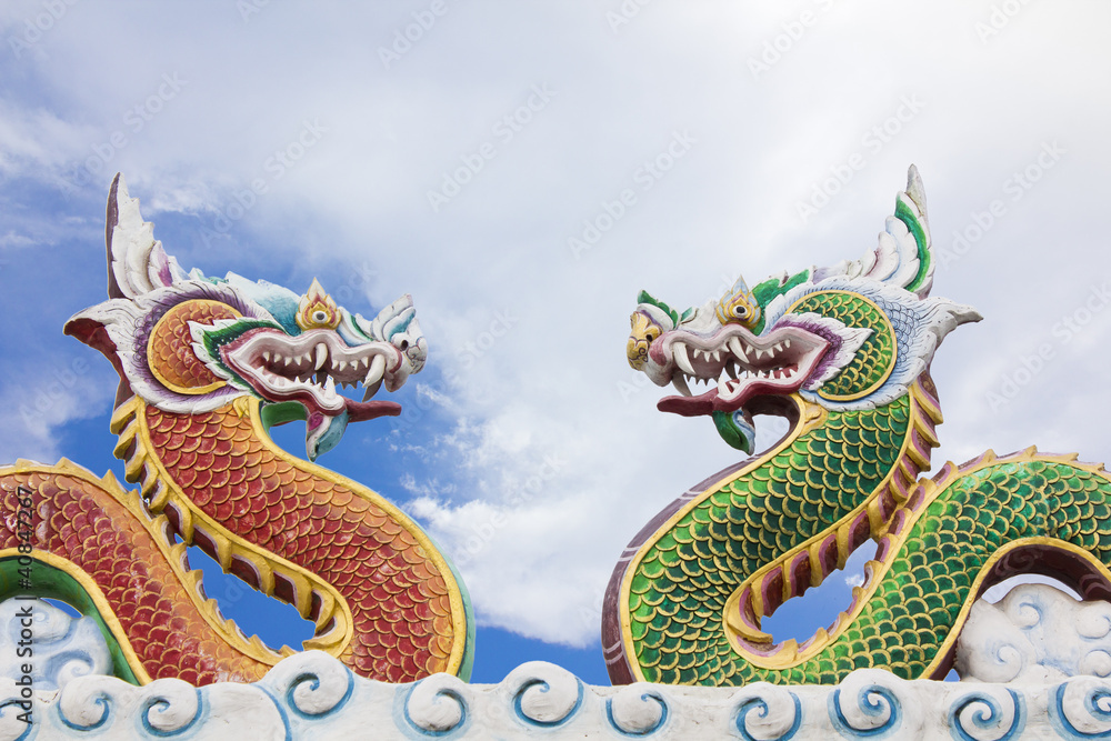 Fototapeta premium Chinese dragon statue on blue sky background