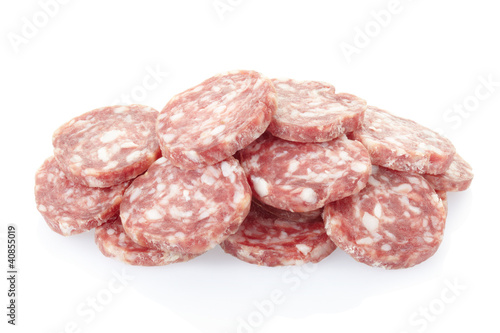 Salami slices pile on white, clipping path included