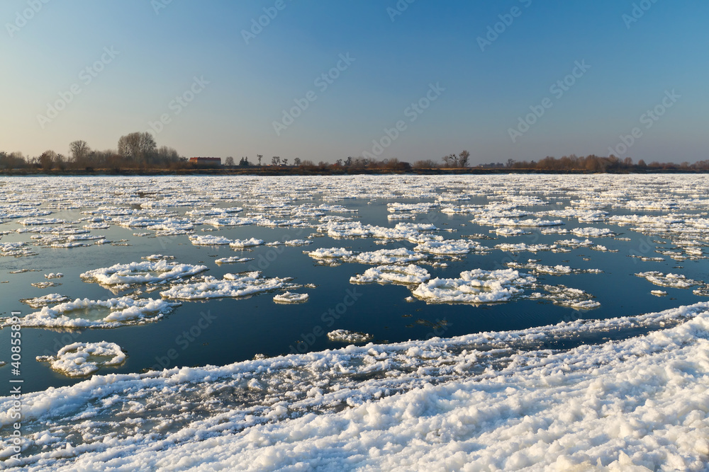 Ice floe flowing on Wisla river at winter