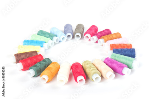 circle of colorful threads on a white