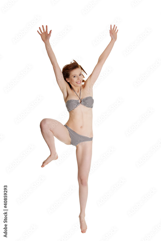 Happy summer woman in bikini jumping Happy summer woman in bikini jumping