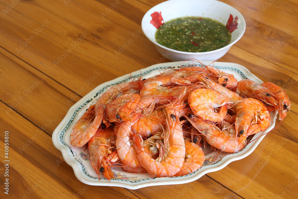 Steamed shrimp in dish on the table with seafood sauce Steamed shrimp in dish on the table with seafood sauce