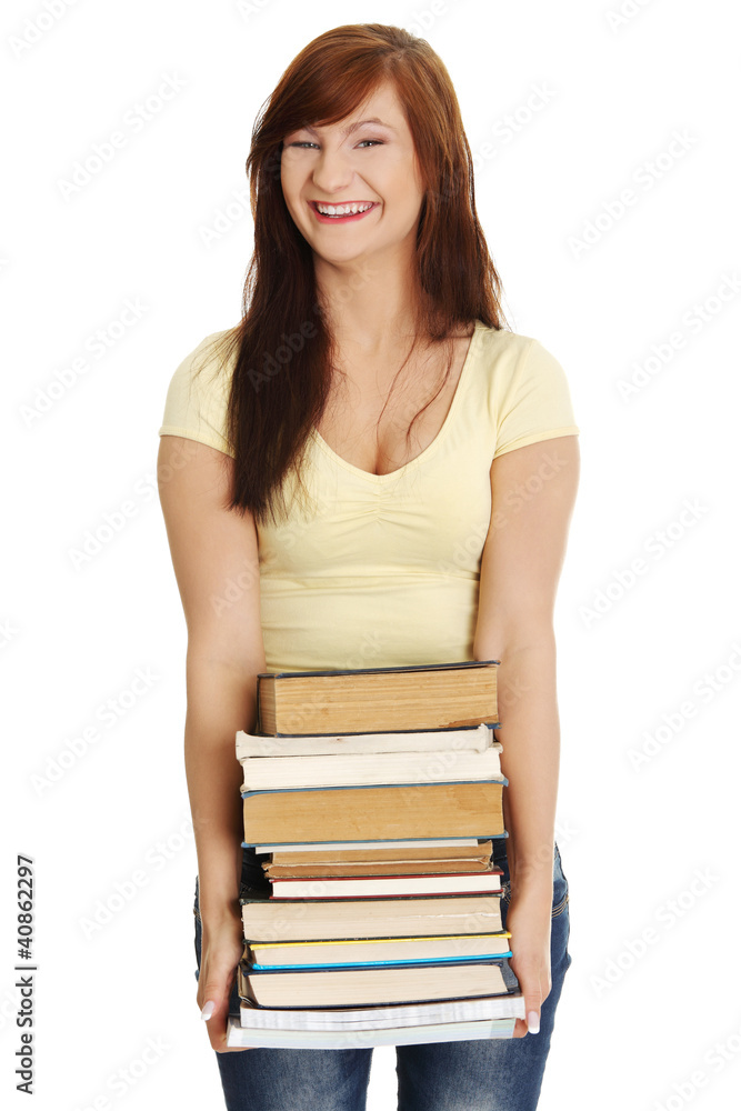 Happy teen woman holding books , isolated on white background Happy teen woman holding books , isolated on white background