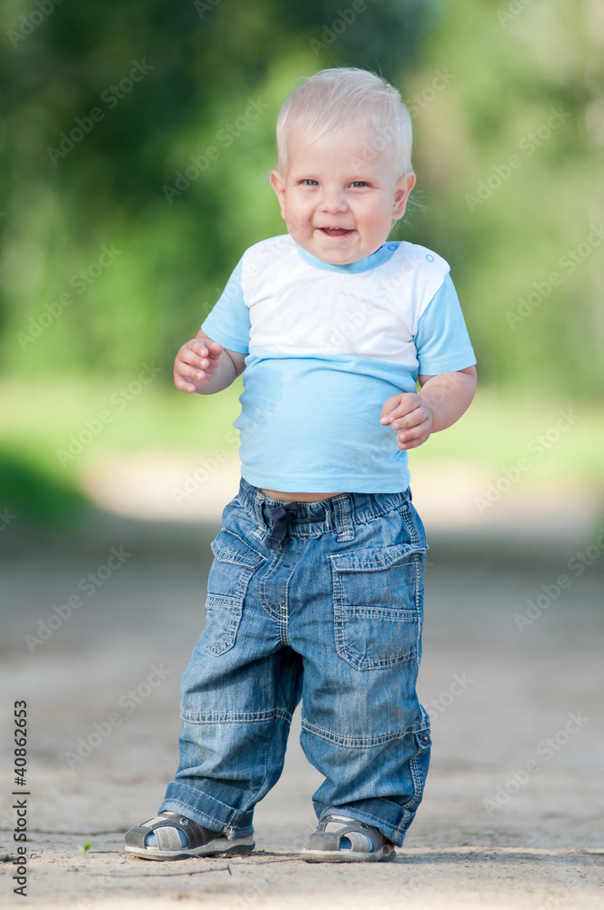 Happy little boy in the green park Happy little boy in the green park