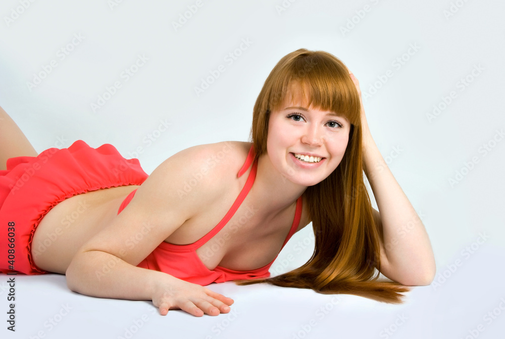 Beautiful redheaded woman in a swimsuit