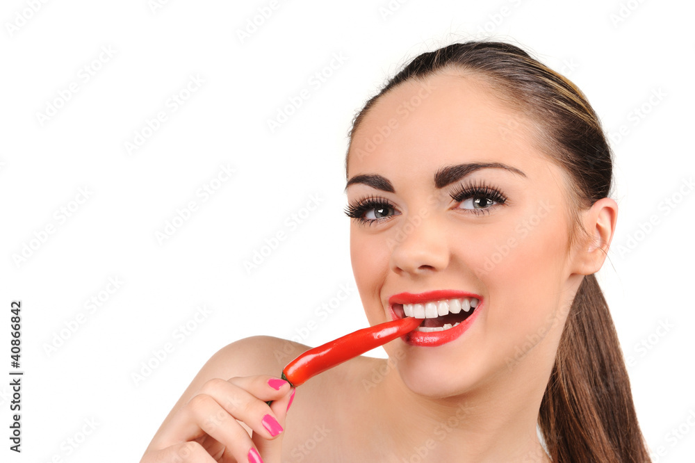 Young woman with chili pepper isolated on white Young woman with chili pepper isolated on white