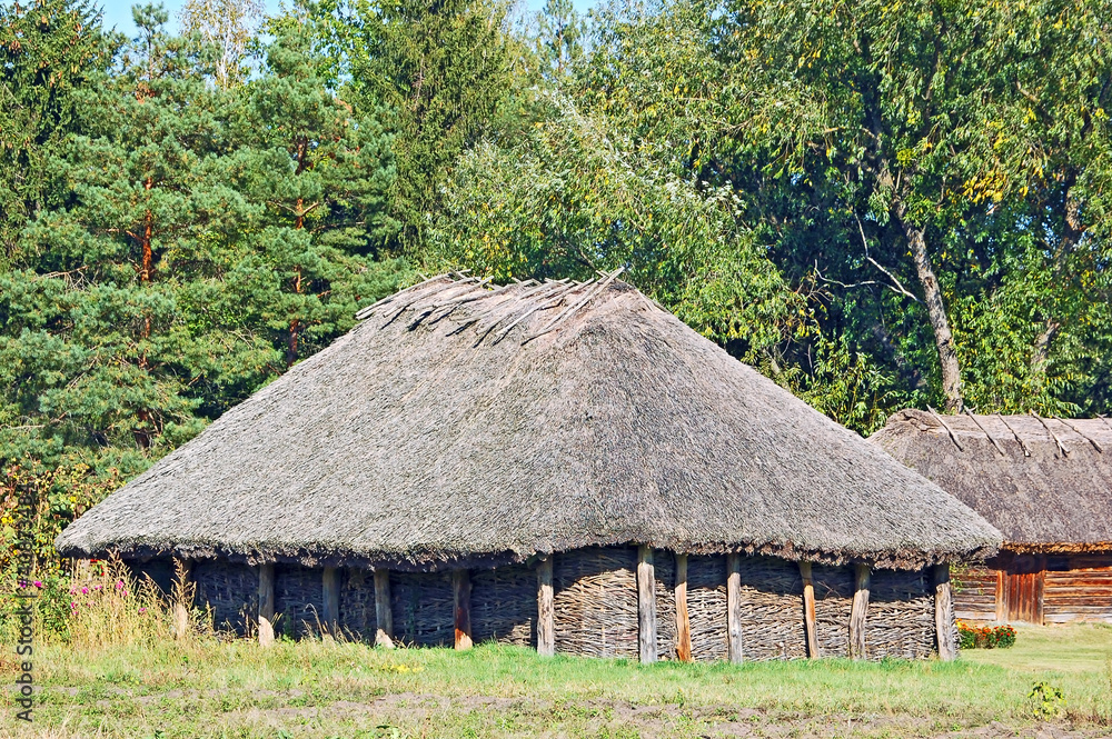 Ancient traditional ukrainian rural barn with a straw roof Ancient traditional ukrainian rural barn with a straw roof