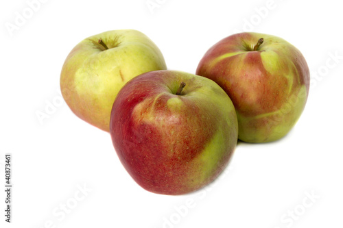 juicy red and yellow apples on white background