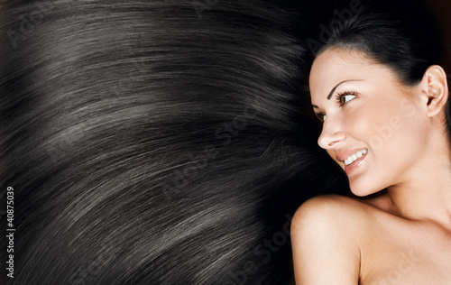 woman with long healthy shiny hair photo