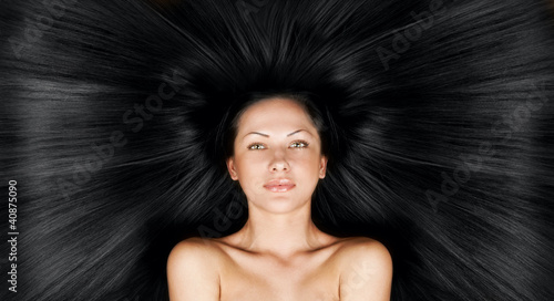 woman with long healthy natural hair photo