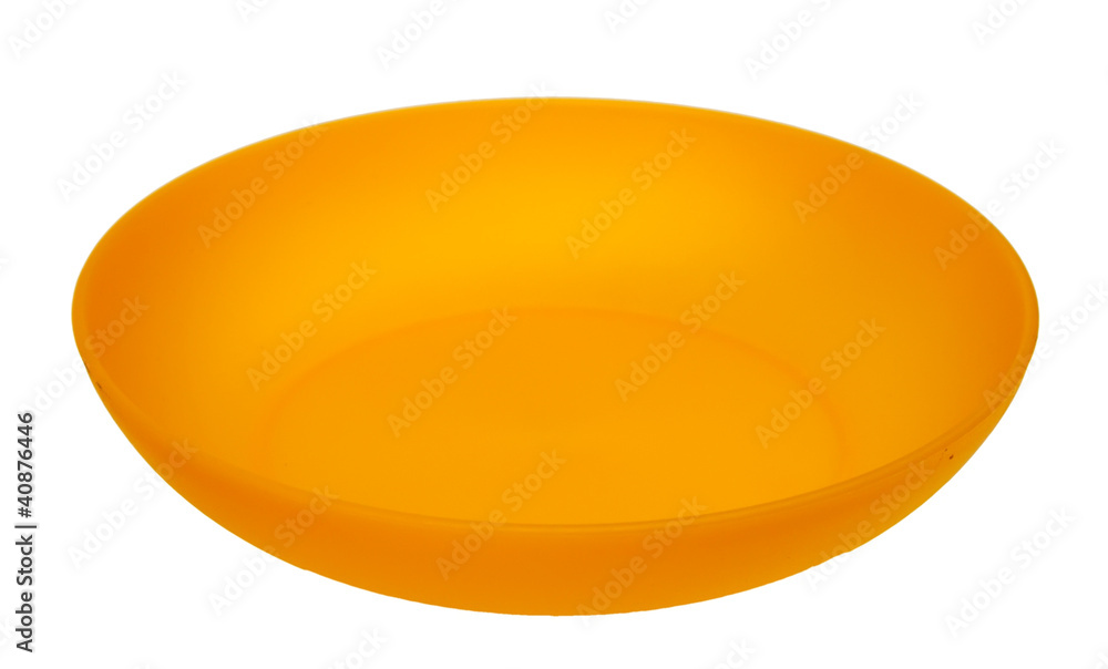 Yellow plastic plate, isolated on a white background. Yellow plastic plate, isolated on a white background.