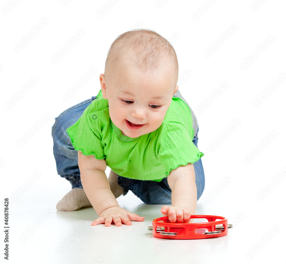 Baby girl playing with musical toy. Isolated on white background Baby girl playing with musical toy. Isolated on white background
