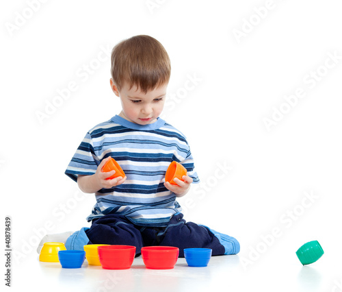 Funny little child is playi...