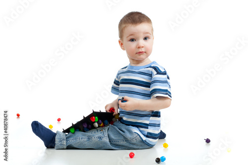 Cute child boy playing with...