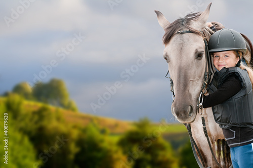Horse riding - portrait of lovely equestrian with horse