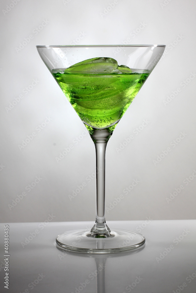Green cocktail cup and ice