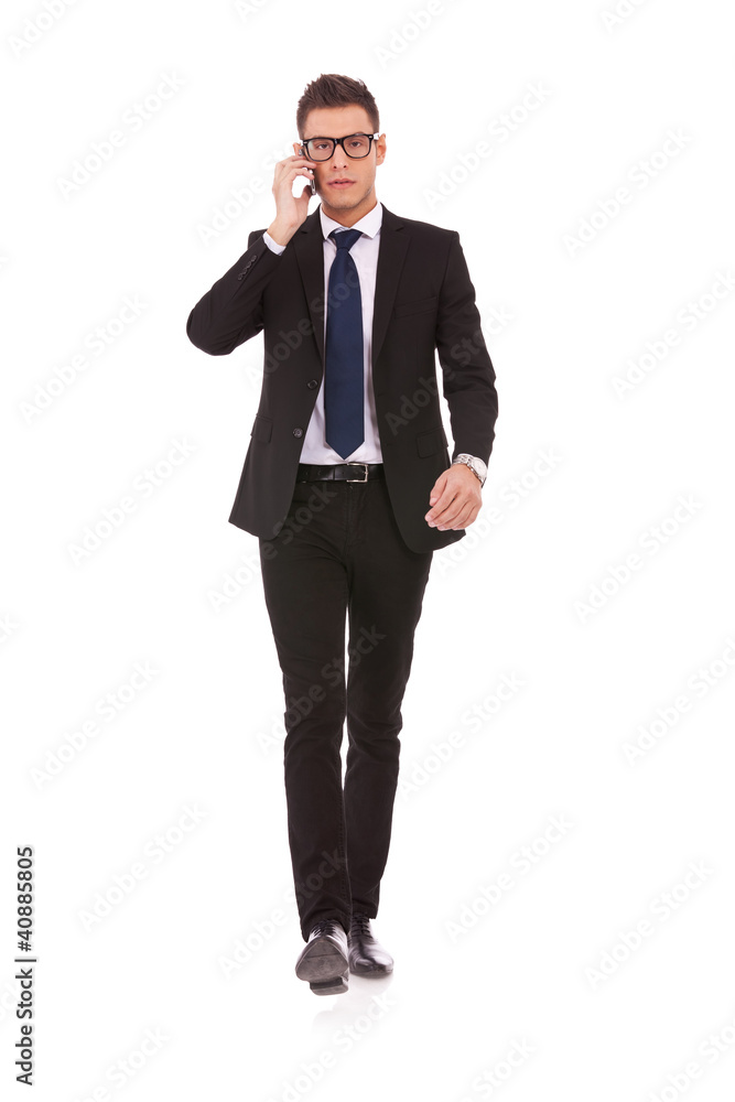 business man with glasses talking on mobile phone business man with glasses talking on mobile phone