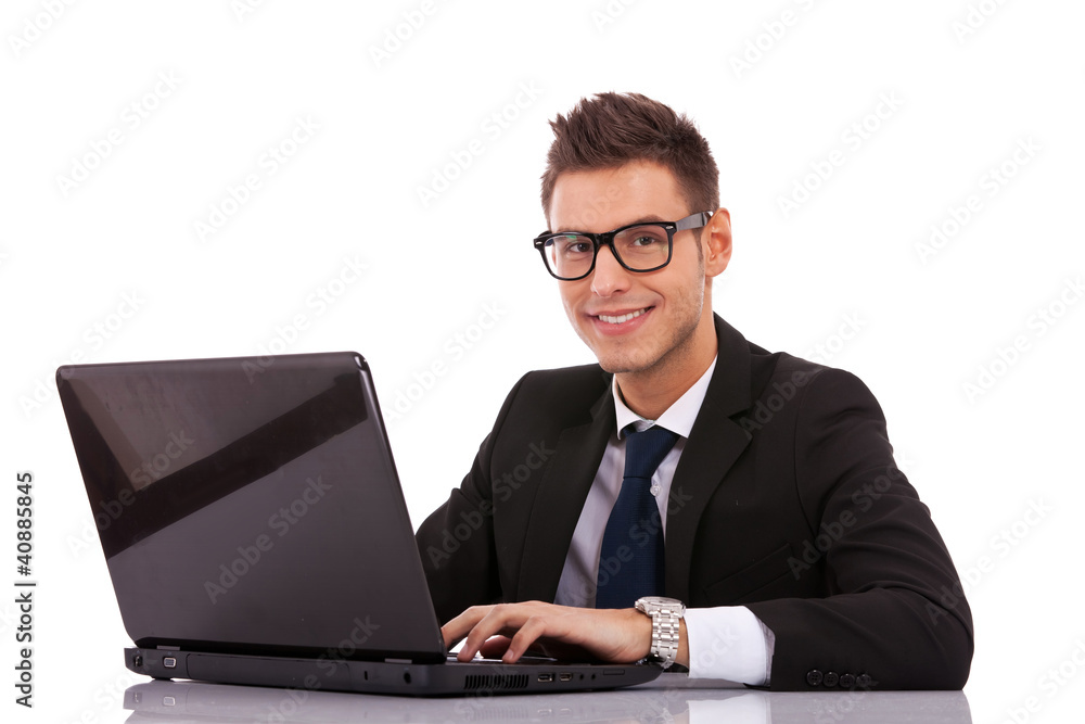business man wearing glasses using a laptop business man wearing glasses using a laptop