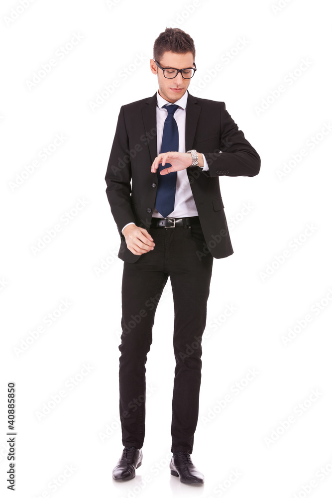business man wearing glasses looking at watch business man wearing glasses looking at watch