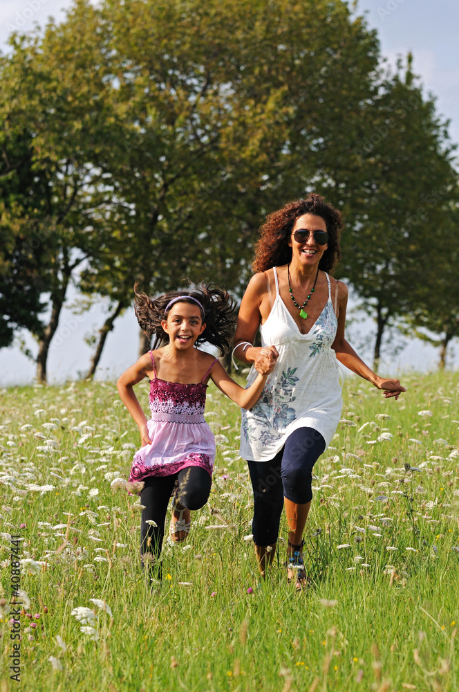 Fototapeta premium mother and daughter running