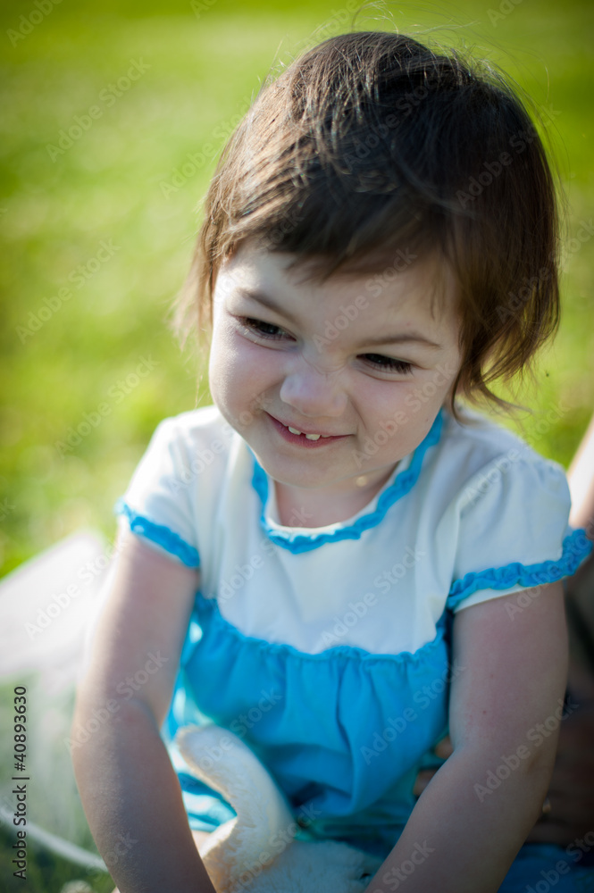 A little girl in a summer park A little girl in a summer park