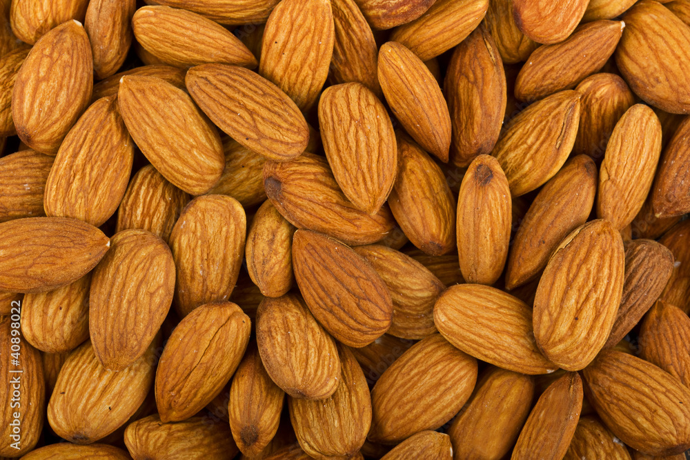 Heap of raw almonds nuts background Heap of raw almonds nuts background