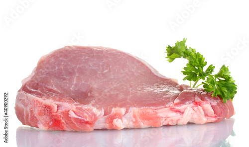 sliced raw pork steak with parsley isolated on white