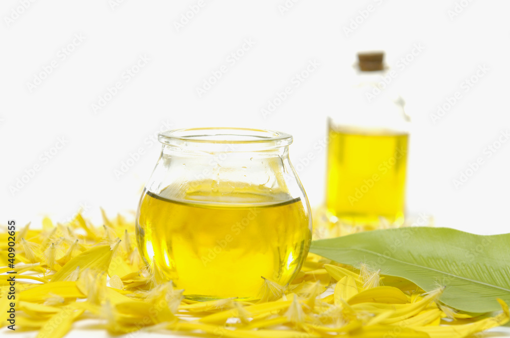 beauty treatment- bottle of massage oil and candle beauty treatment- bottle of massage oil and candle