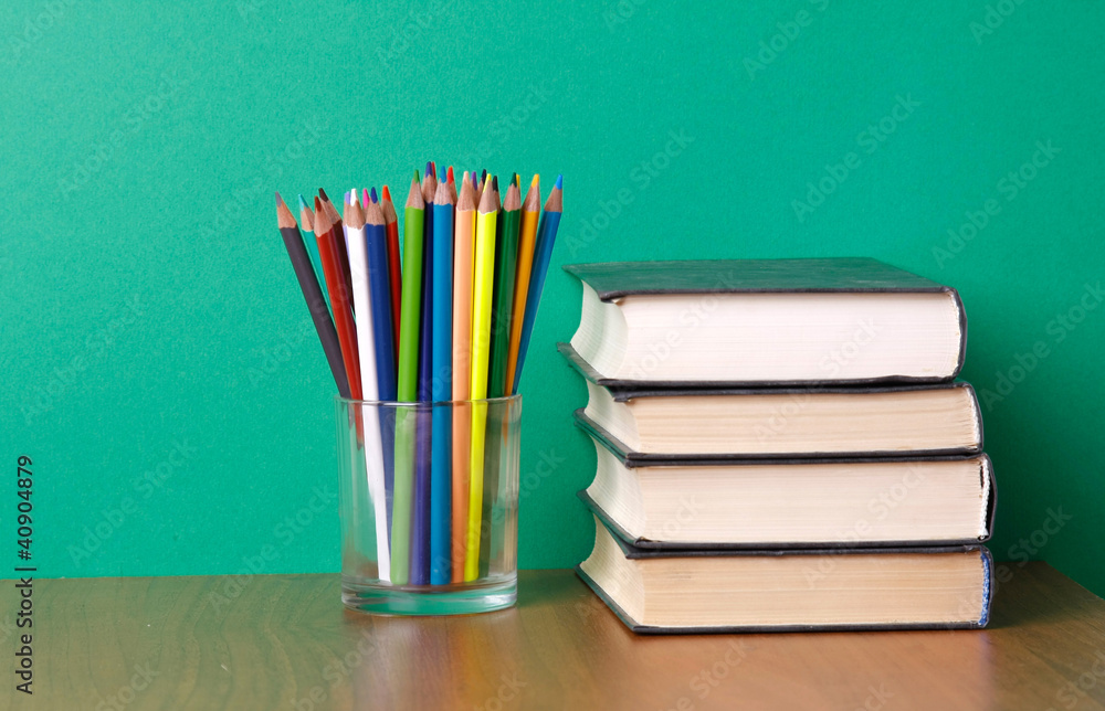 books and pencils on the desk